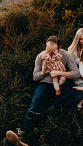 Dad kissing his baby girl during a photo session at sunset in Roswell, GA.